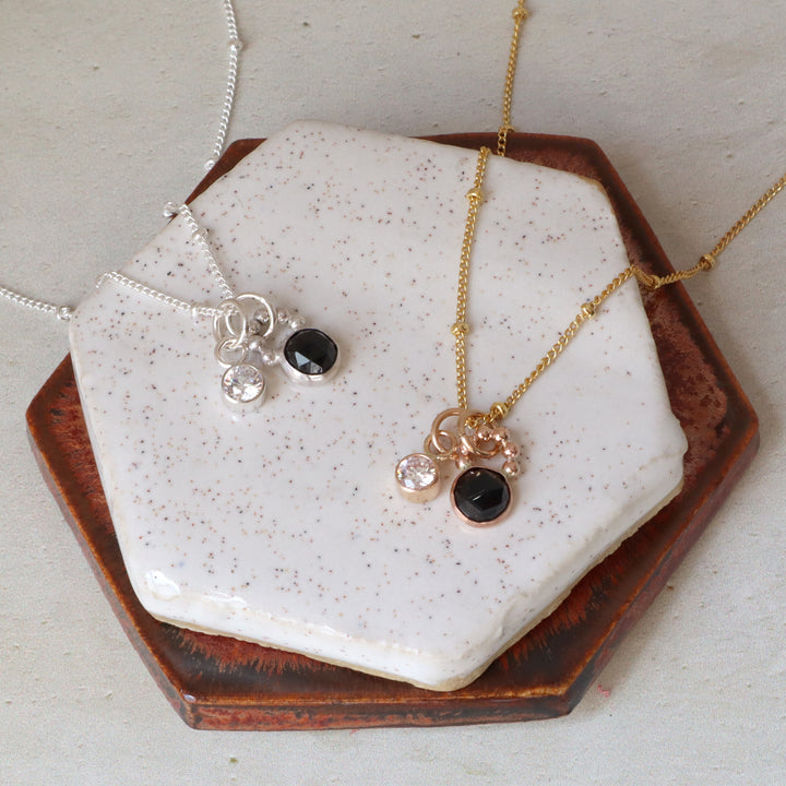 one of a kind charm necklace with black spinel and a clear cz in sterling silver or 14k gold filled