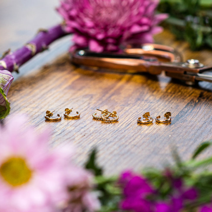 Ear hugger hoop earrings in smooth, hammered or beaded texture and sterling silver or 14k gold filled by Blossom and Shine