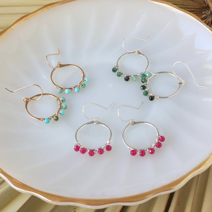birthstone hoop earrings in sterling silver and 14k gold filled, showing emerald, ruby and turquoise