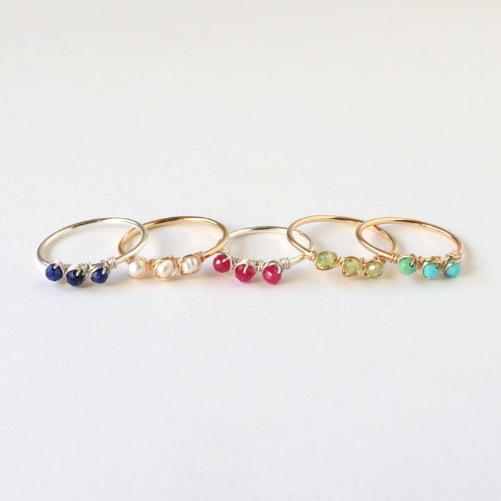 birthstone rings in sterling silver and 14k gold fill, showing lapis, pearl, ruby, peridot and turquoise