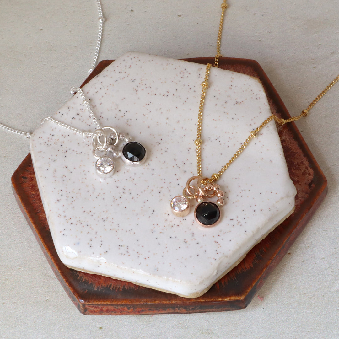 one of a kind charm necklace with black spinel and a clear cz in sterling silver or 14k gold filled