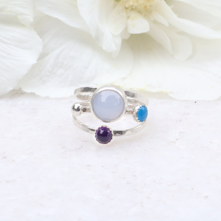one of a kind sterling silver hammered triple ring band featuring blue chalcedony, blue onyx and amethyst gemstones