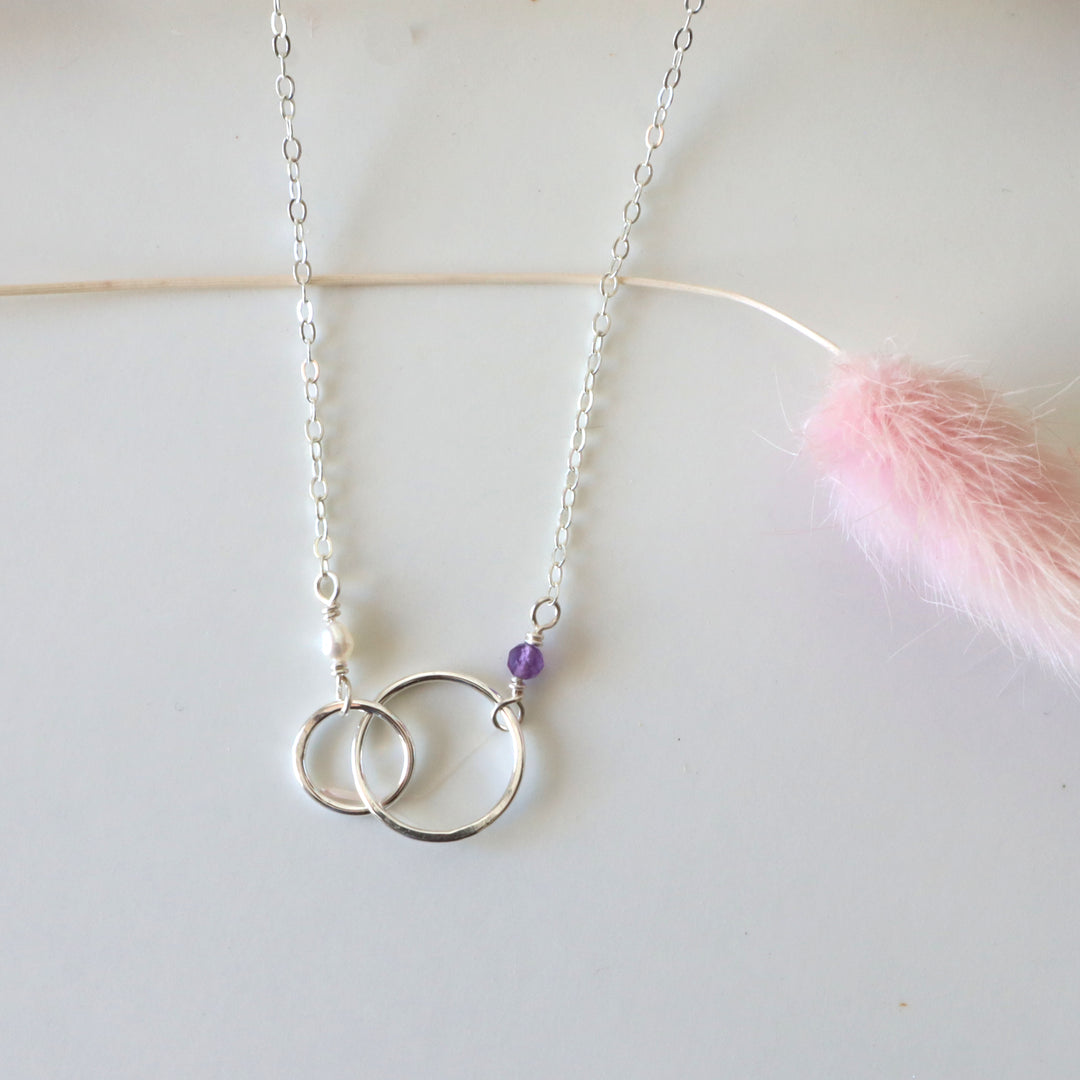 personalized double circle linked necklace in sterling silver with amethyst and pearl gemstones