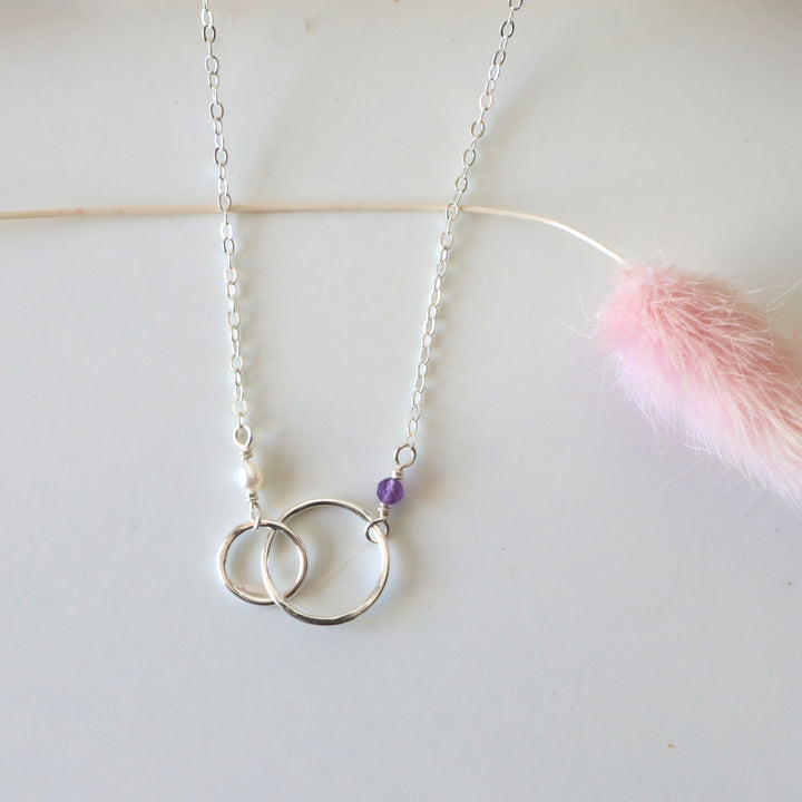 personalized double circle linked necklace in sterling silver with amethyst and pearl gemstones