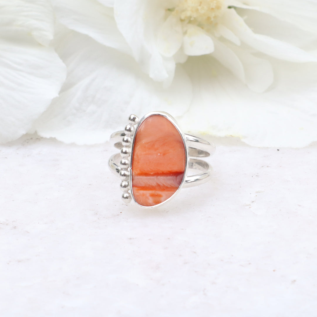 one of a kind sterling silver double ring band featuring a spiny oyster shell cabachon