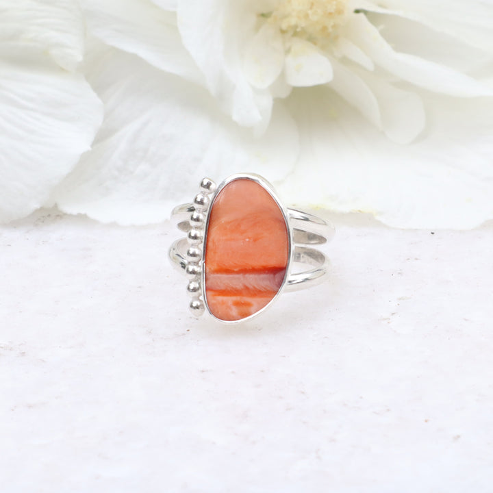 one of a kind sterling silver double ring band featuring a spiny oyster shell cabachon