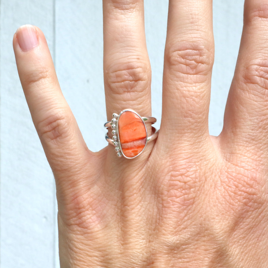 one of a kind sterling silver double ring band featuring a spiny oyster shell cabachon