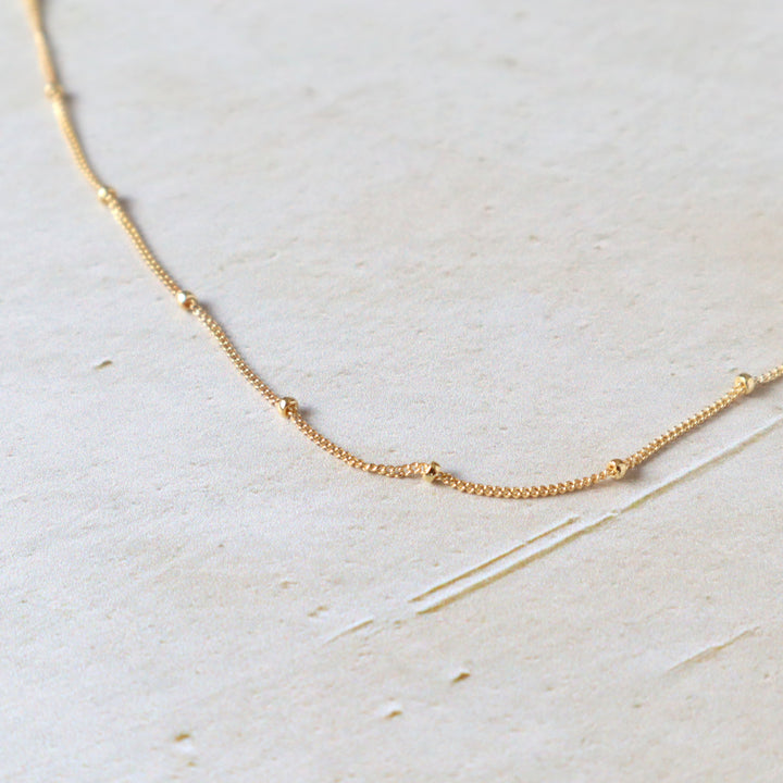 twinkle chain dainty chain necklace with spaced out beads in sterling silver or 14k gold filled